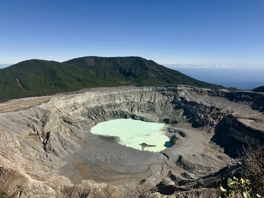 The turquoise acid lake inside the Poás Volcano crater