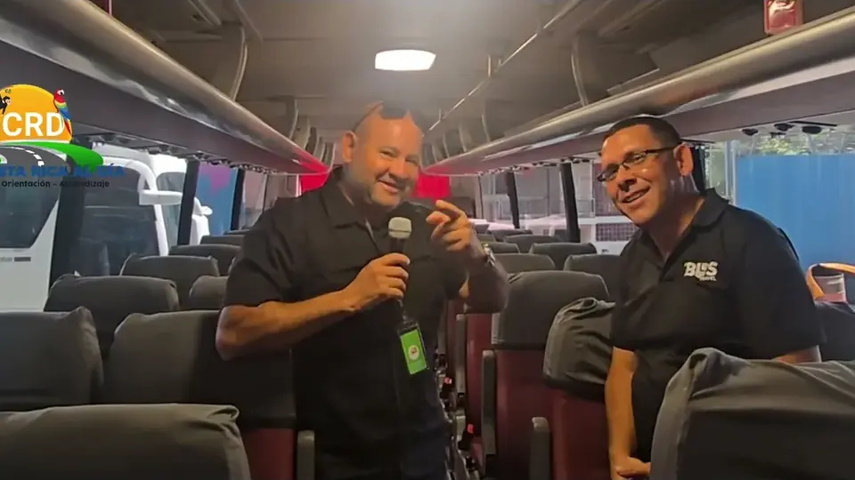 Oscar Calvo and a transport partner inside a tour bus in Panama